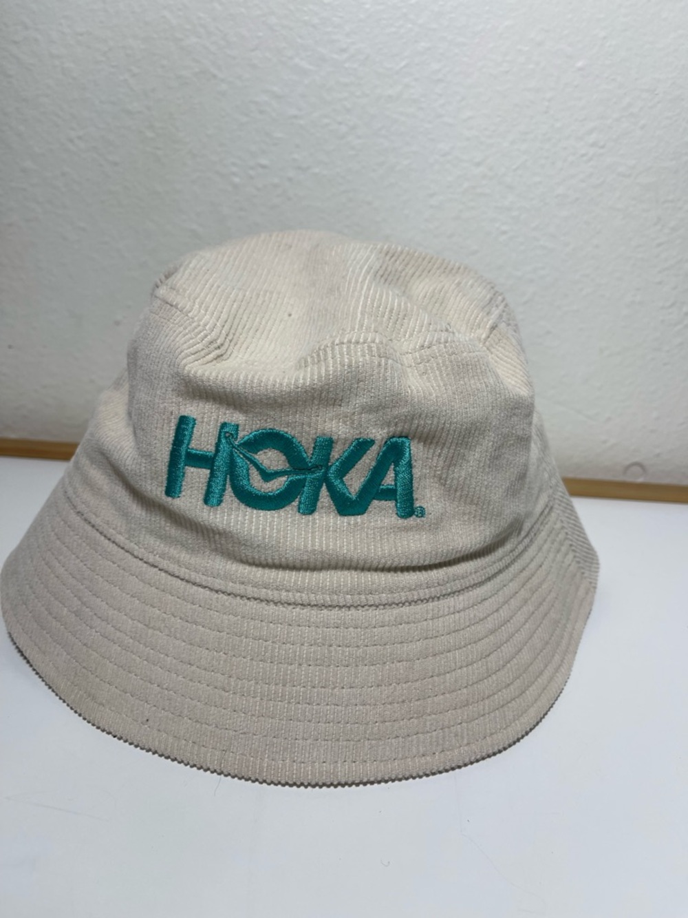 Hoka Beige Corduroy Bucket Hat with Teal Embroidered Logo